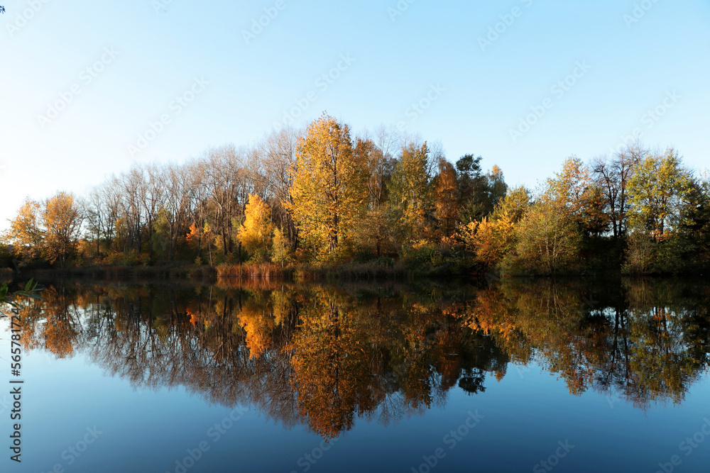 Picturesque view of lake and trees on autumn day Picturesque view of lake and trees on autumn day