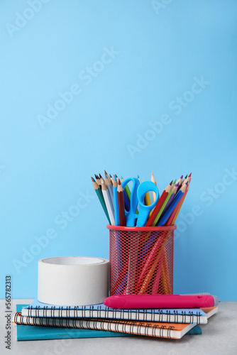 Different school stationery on table against light blue background. Back to school © New Africa