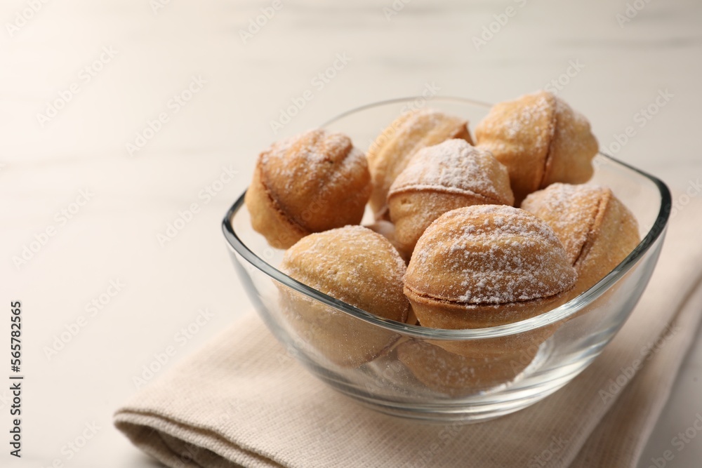 Homemade walnut shaped cookies with condensed milk on white marble table, closeup. Space for text Homemade walnut shaped cookies with condensed milk on white marble table, closeup. Space for text