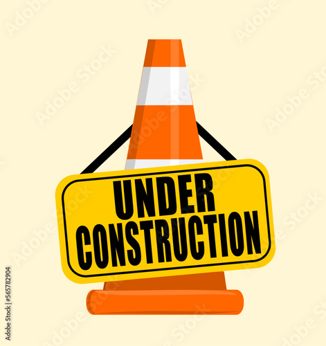 Under construction placard hanging on traffic safety cone #565782904