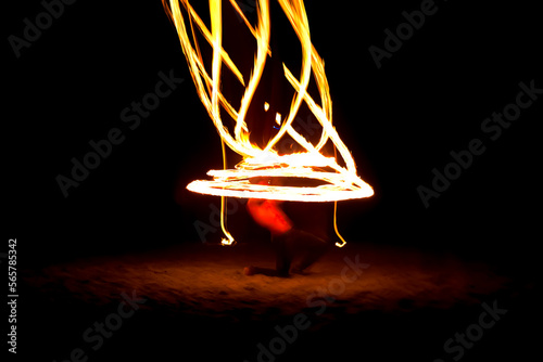 Blurry light of fire spinning at full moon night party use for web design and wallpaper background © Wira SHK