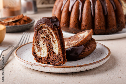 Chocolate marble bundt cake with chocolate glaze drizzled on top photo