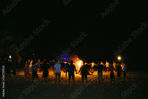 group of people at the fire