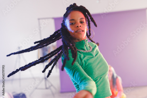 Image of happy afican american female hip hop dancer in studio photo