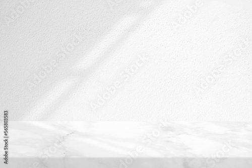 Marble Table with White Stucco Wall Texture Background with Light Beam and Shadow of Roof, Suitable for Product Presentation Backdrop, Display, and Mock up.