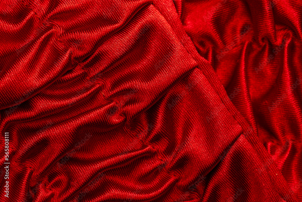 Obraz premium fabric in red shiny waves as a detail as a graphic element for the background