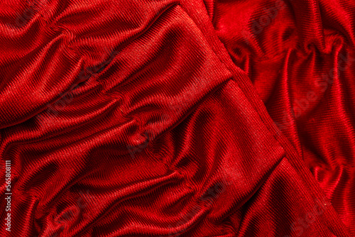 fabric in red shiny waves as a detail as a graphic element for the background