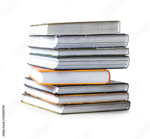 many books in a pile stand on the table on Isolated white background.