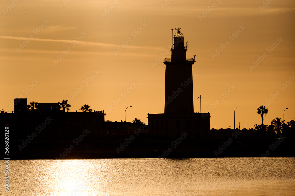 silhouette of a lighthouse in dawn in Malaga, Spain