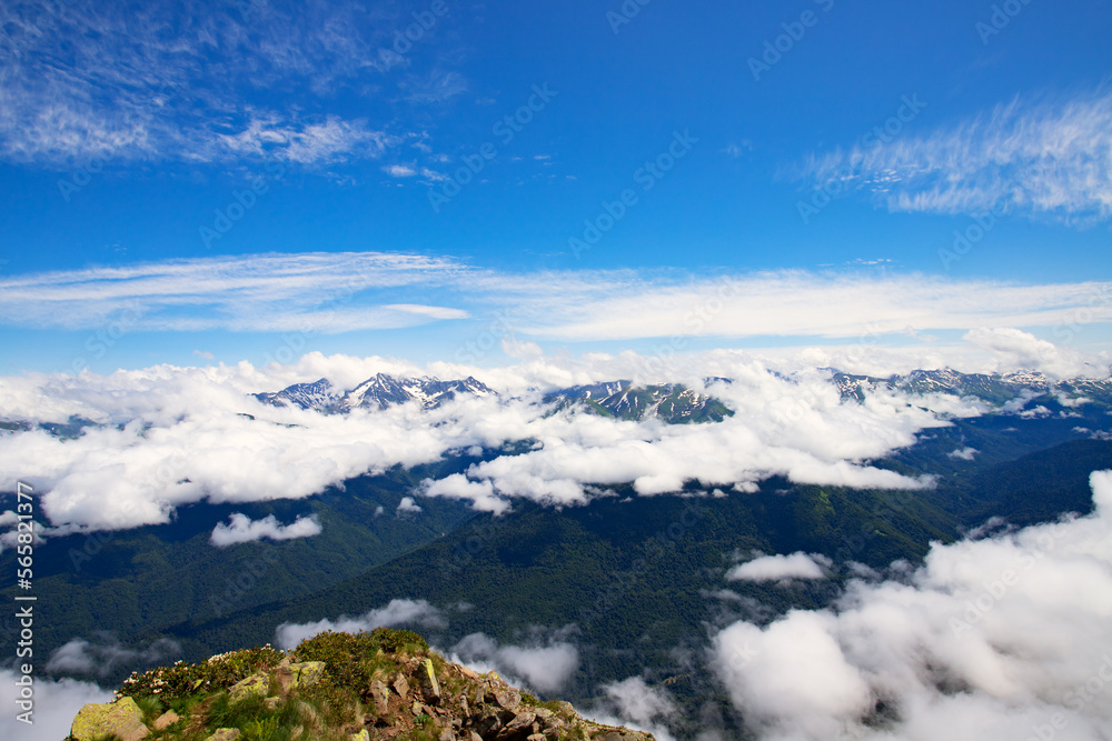 mountain landscape with blue sky above clouds