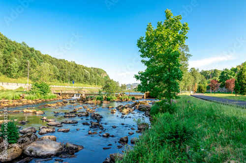 Obraz na płótnie A walk path along scenic small river with rocks close to Algard town, Norway, June 2018 w salonie