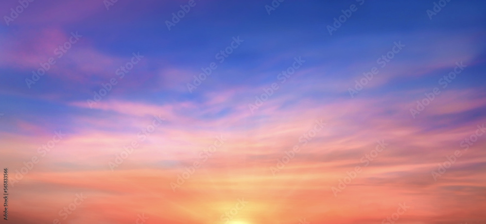 Real amazing panoramic sunrise or sunset sky with gentle colorful clouds. Long panorama, crop it. Evening sky scene with golden light from the setting sun