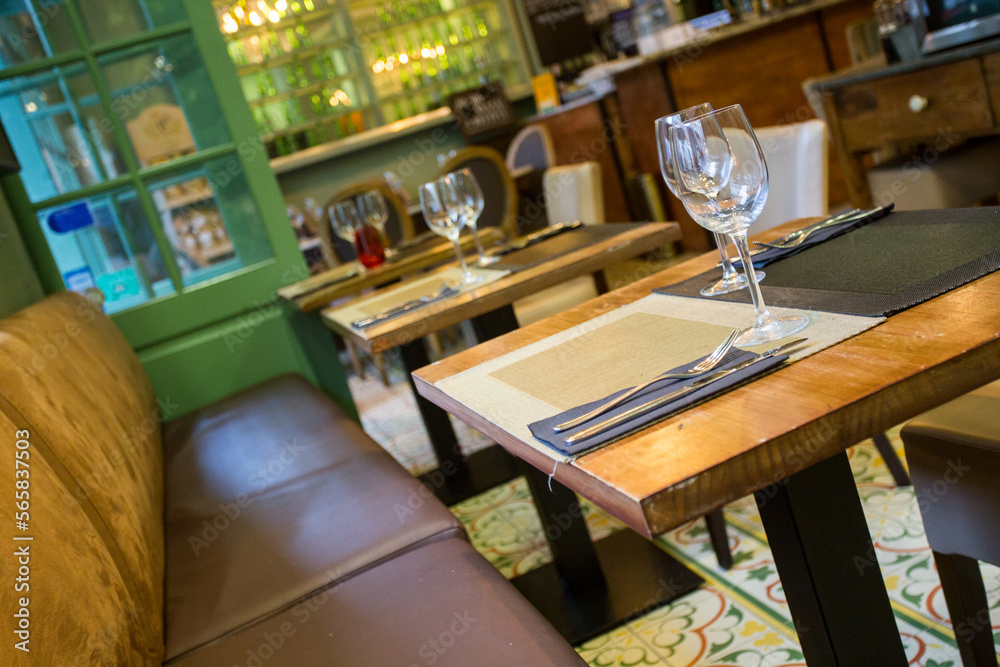 Elegant restaurant table with cutlery, crockery and glasses.