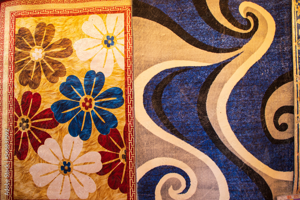 Naklejka premium Colorful paintings carpets on display at the bazaar in Istanbul, Turkey