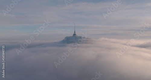 Jested tower mountain hill with snow mist and fog at golden hour