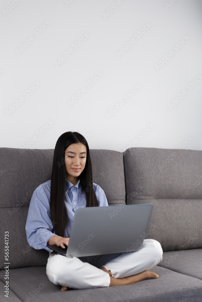Programmer girl coding on computer at home. Young asian girl studying online with modern laptop. Focused POC female using notebook pc Programmer girl coding on computer at home. Young asian girl studying online with modern laptop. Focused POC female using notebook pc