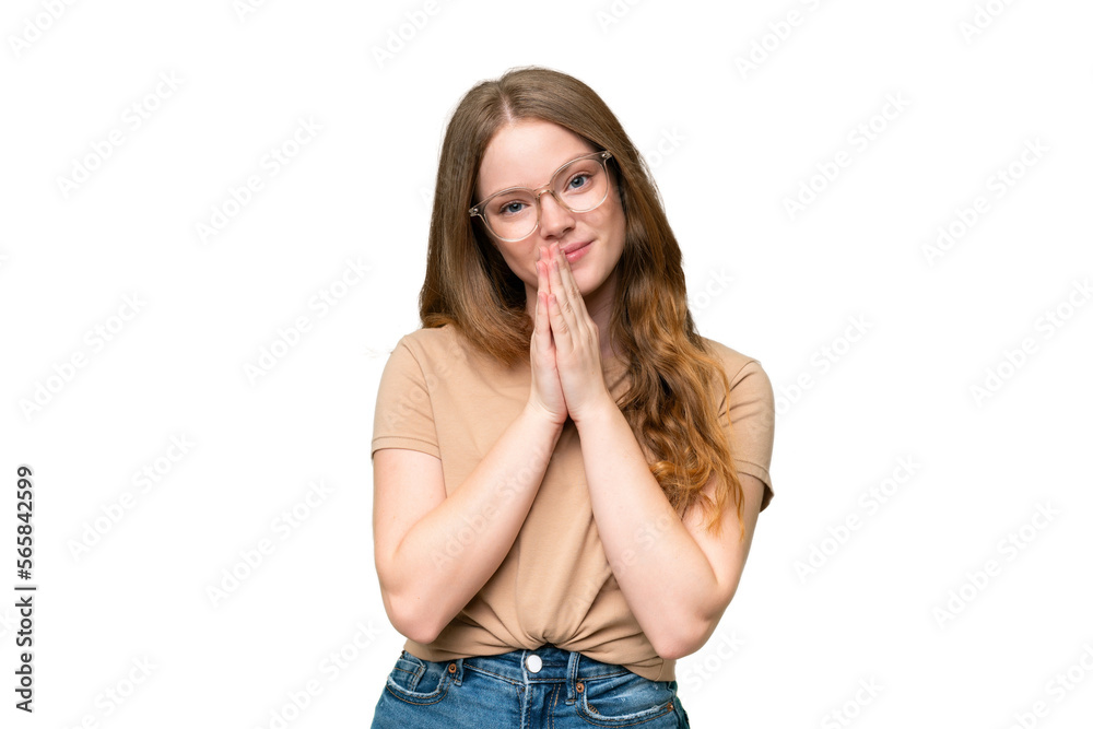 Young pretty woman over isolated background keeps palm together. Person asks for something Young pretty woman over isolated background keeps palm together. Person asks for something