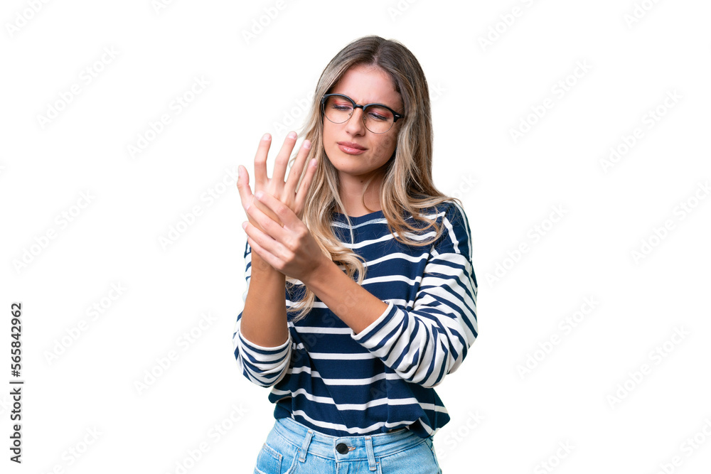 Young Uruguayan woman over isolated background suffering from pain in hands Young Uruguayan woman over isolated background suffering from pain in hands
