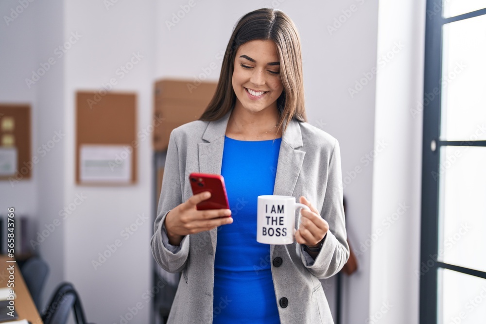 Young beautiful hispanic woman business worker using smartphone drinking coffee at office Young beautiful hispanic woman business worker using smartphone drinking coffee at office