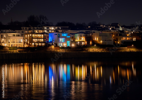 Night landscape and light of houses on Phoenix lake in Dortmund Germany