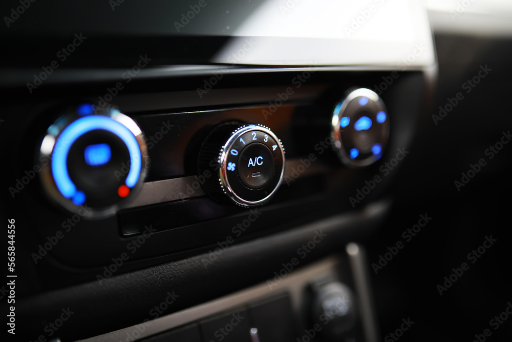 The process of choosing climate control in the car. Various controls in auto switches. Modern car interior