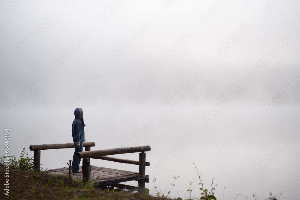 Happy traveler woman taking photo Nature view by smartphone