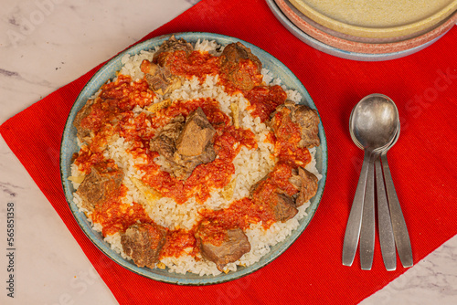 Egyptian Fettah, a traditional plate combined of rice, bread, meat and tomato sauce.  Usually cooked in the days of Eid Aladha, the Islamic Feast.  © Israa
