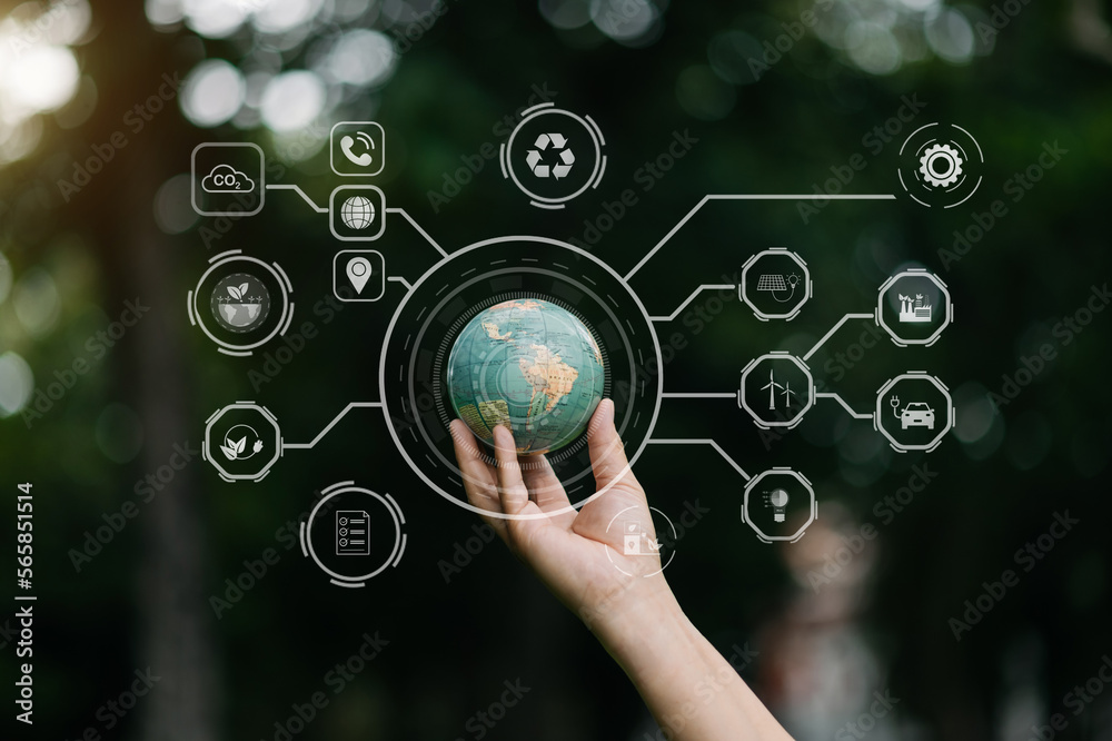 Earth in nature's time in hands with energy resource icon. Earth day. Energy saving concept. in sun light. Earth in nature's time in hands with energy resource icon. Earth day. Energy saving concept. in sun light.