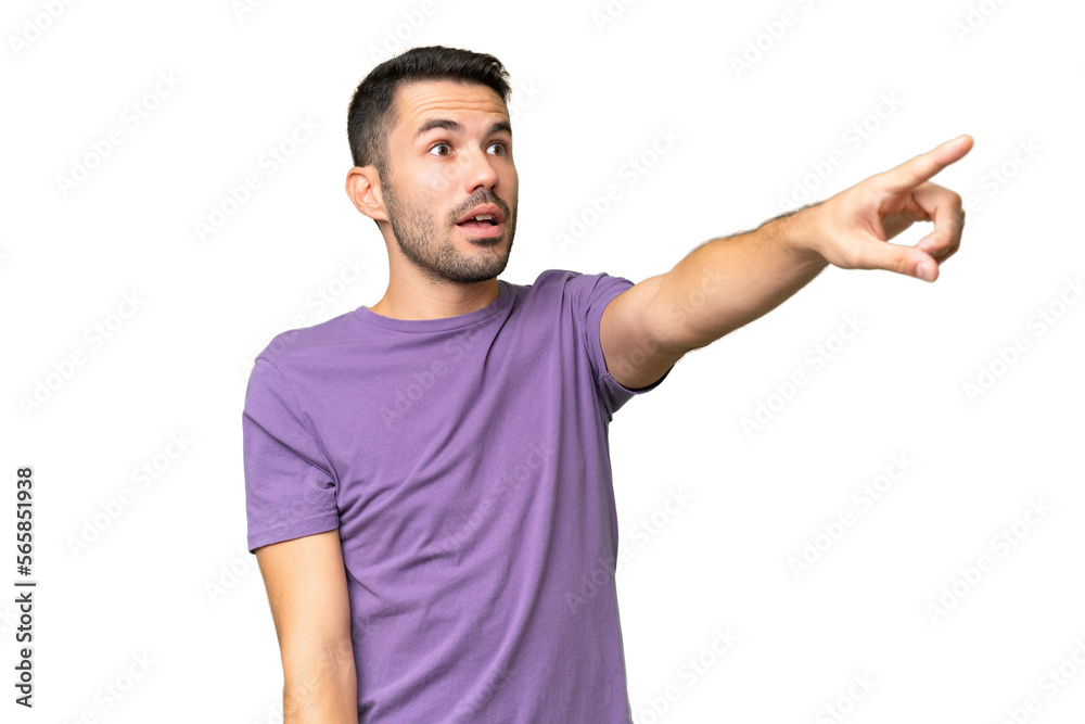 Young handsome caucasian man over isolated background pointing away Young handsome caucasian man over isolated background pointing away