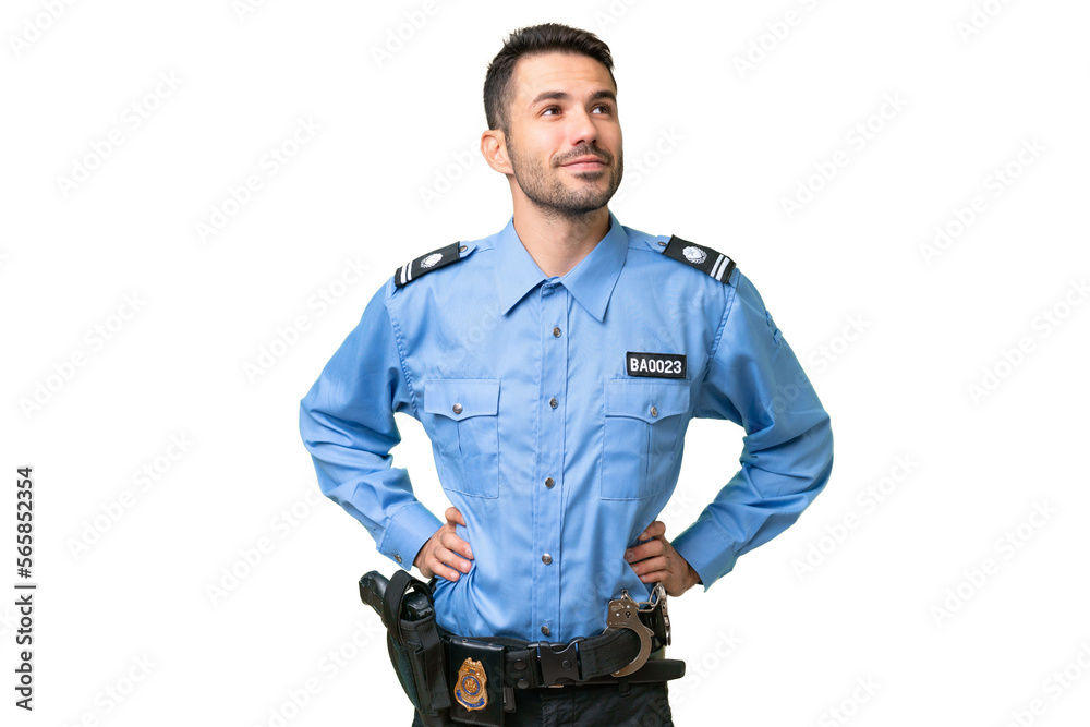 Young police caucasian man over isolated background posing with arms at hip and smiling Young police caucasian man over isolated background posing with arms at hip and smiling