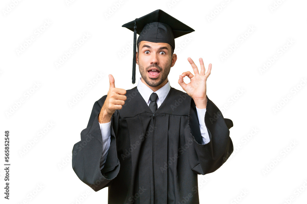 Young university graduate man over isolated background showing ok sign and thumb up gesture Young university graduate man over isolated background showing ok sign and thumb up gesture