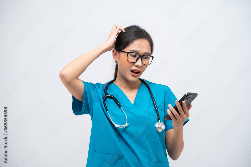 Portrait of Asian female doctor with stethoscope using her mobile phone isolated on white background. Portrait of Asian female doctor with stethoscope using her mobile phone isolated on white background.