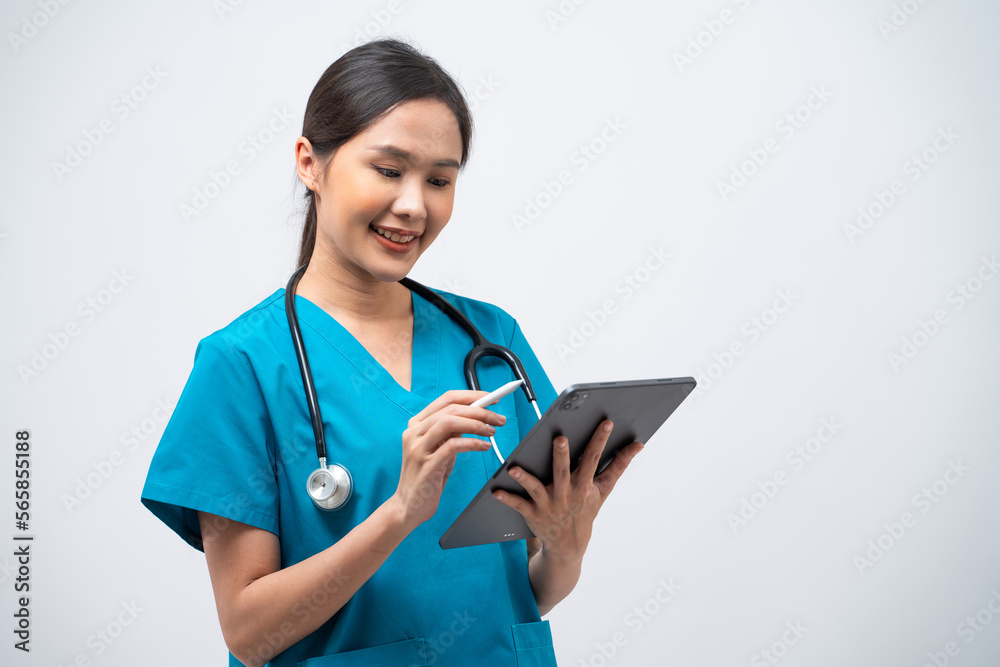 Portrait of Asian female doctor standing with stethoscope using digital tablet isolated on white background. Portrait of Asian female doctor standing with stethoscope using digital tablet isolated on white background.