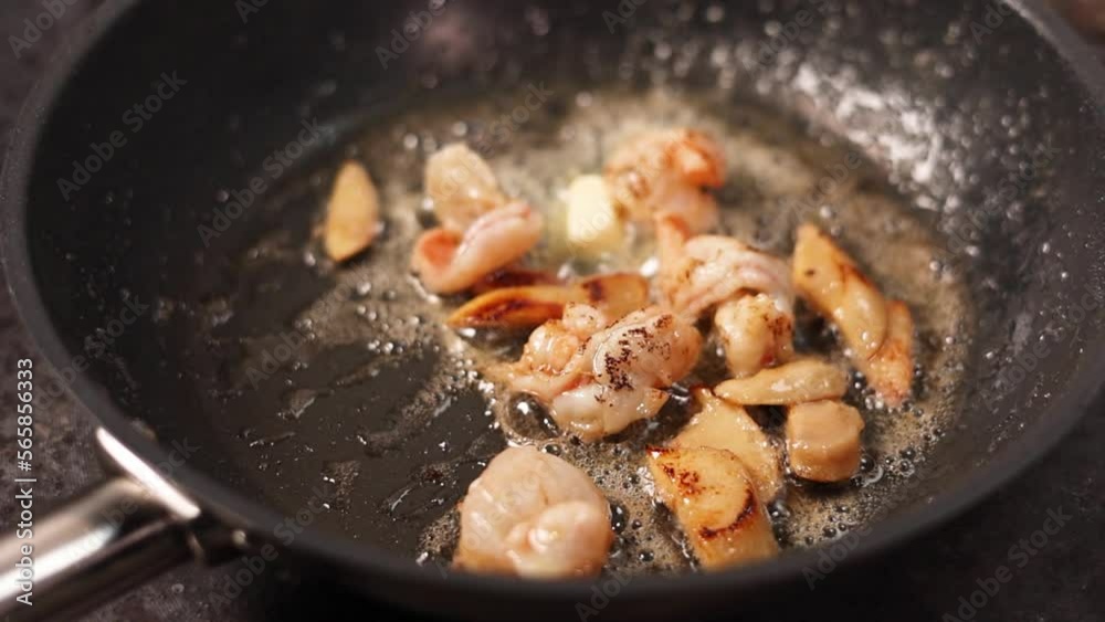 the chef prepares a seafood dish
the chef prepares a seafood dish