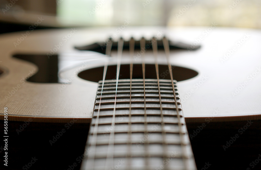 Fototapeta premium acoustic guitar, Used to play music and notes, for sing a song, macro abstract