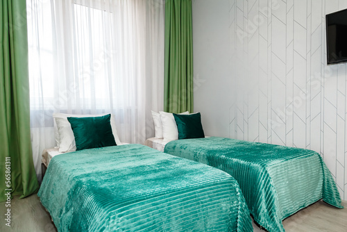 фотографія hotel room bedroom with two separate single beds