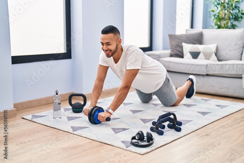 African american man smiling confident training abs exercise at home