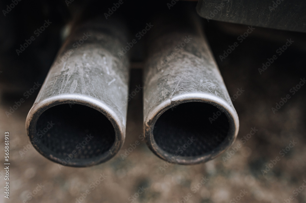Two exhaust pipes of a sports car close-up. Photography, tuning. Two exhaust pipes of a sports car close-up. Photography, tuning.