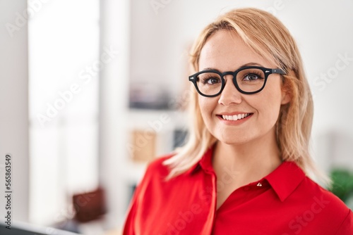 Young blonde woman business worker smiling confident at office