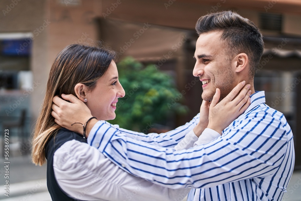 Man and woman couple smiling confident hugging each other at street Man and woman couple smiling confident hugging each other at street