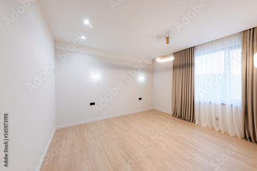 clean large bright room with white walls and lighting