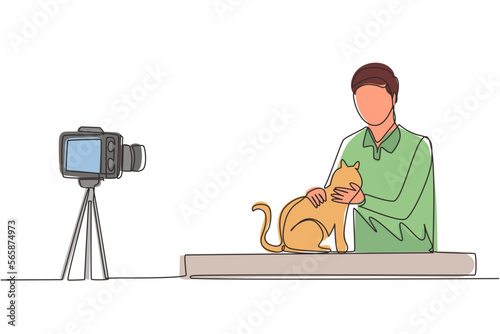 Single one line drawing teenage pet blogger. Teen boy with cat recording video on camera. Hobbies and leisure, blogging about pet, animal lover. Continuous line draw design graphic vector illustration