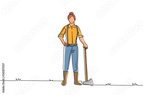 Single one line drawing woman lumberjack with axe standing wearing suspender shirt, jeans and boots. Female woodcutter pose on logging forest. Continuous line draw design graphic vector illustration