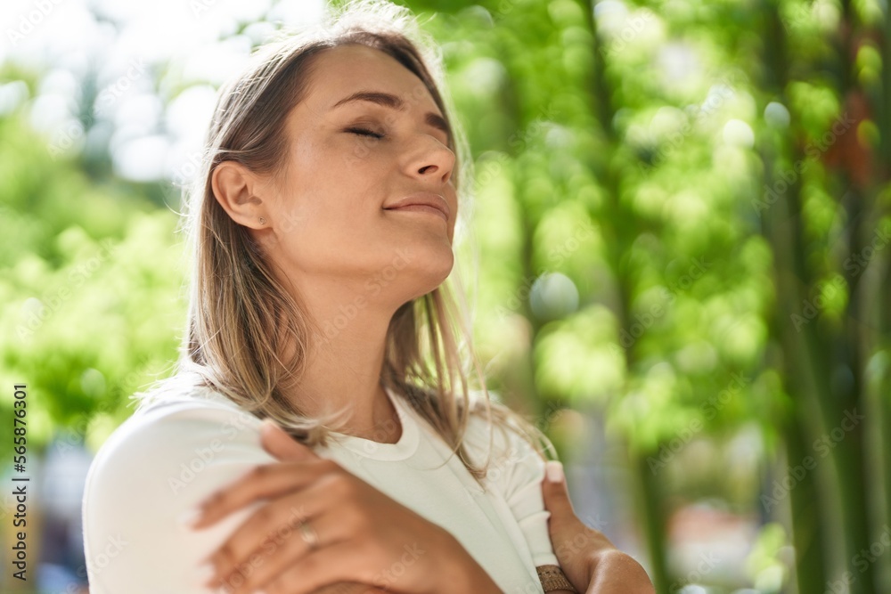 Young caucasian woman smiling confident breathing at park Young caucasian woman smiling confident breathing at park