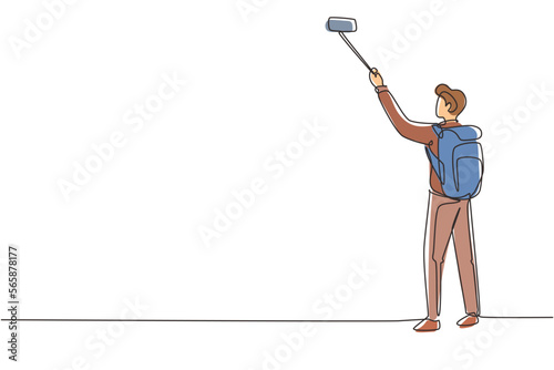 Single one line drawing young man traveler with backpack hiking in mountain while recording video using his smartphone. Travel blogger. Modern continuous line draw design graphic vector illustration