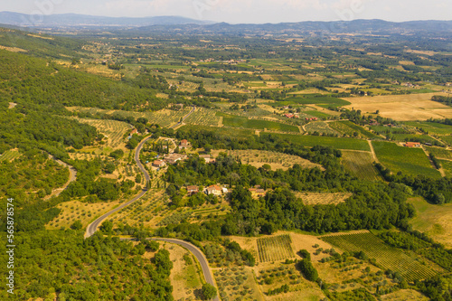Drone photography of tuscan rural landscape of small olive tree farms and vineyards