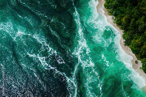 green water surface, top view nature texture of the ocean and a forested coast, generative ai wallpaper