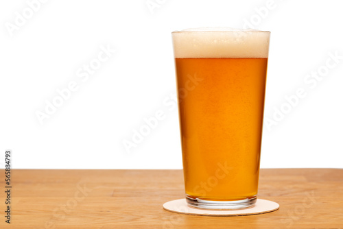 Full pint glass of beer on a table