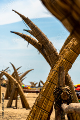 fishing boat next to the beach in the sand of a very large size and typical of the region