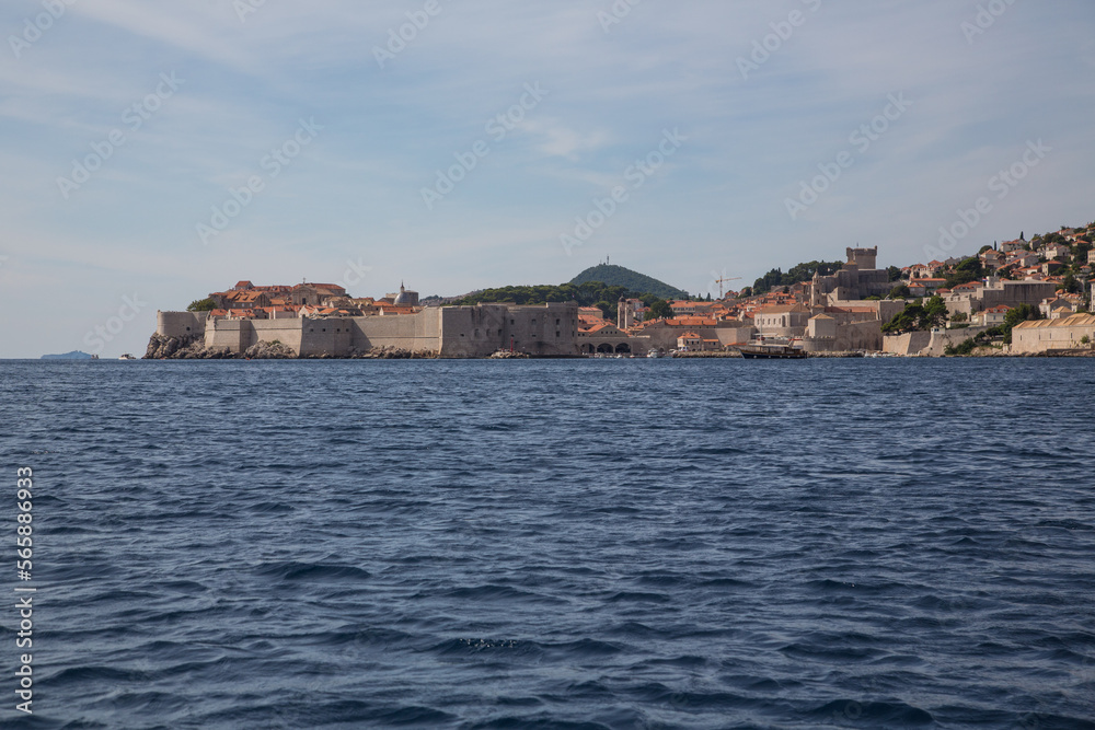 Dubrovnik, Croatia-the Adriatic pearl: Sea view to the impressive and famous walls surrounding the old town and the entrance to the harbor and one of the best preserved fortification systems in Europe